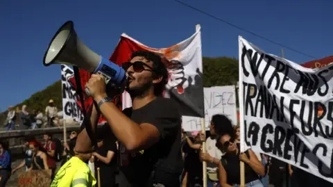 Nationwide Strikes Break Out Against Spending Cuts
